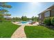 Picturesque backyard with a sparkling pool, lush green grass, and serene landscaping at 2015 Saint Andrews Ct, Franklin, IN 46131