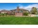 Beautiful backyard view of the house with a well-manicured lawn and inviting deck at 2015 Saint Andrews Ct, Franklin, IN 46131