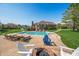 Expansive backyard features pool, fire pit and outdoor seating; perfect for relaxation and entertaining at 2015 Saint Andrews Ct, Franklin, IN 46131