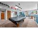 Finished basement with a pool table, kitchenette, and a cozy dining area bathed in natural light at 2015 Saint Andrews Ct, Franklin, IN 46131