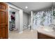 Bright bathroom with a vanity, toilet, and shower with patterned curtain and a walk in closet at 2015 Saint Andrews Ct, Franklin, IN 46131