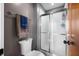 Powder room with toilet, shower, modern lighting, and crisp decor at 2015 Saint Andrews Ct, Franklin, IN 46131