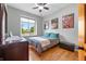 Bedroom with bright window, hardwood floors, and stylish decor at 2015 Saint Andrews Ct, Franklin, IN 46131