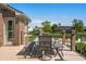 Charming outdoor dining space on a deck overlooking a serene pond and lush greenery at 2015 Saint Andrews Ct, Franklin, IN 46131