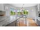 Sun-filled dining area with large windows overlooking scenic pond views at 2015 Saint Andrews Ct, Franklin, IN 46131