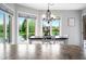 Charming dining area with picturesque views from surrounding windows offering natural light and a serene atmosphere at 2015 Saint Andrews Ct, Franklin, IN 46131