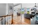 Light-filled entryway showcases an open floor plan, hardwood floors and transitions seamlessly into the dining and living areas at 2015 Saint Andrews Ct, Franklin, IN 46131
