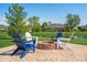 Fire pit with Adirondack chairs has a beautiful pond view, perfect for outdoor gatherings and relaxation at 2015 Saint Andrews Ct, Franklin, IN 46131