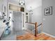 A stylish foyer features wood floors, a gray front door, and modern lighting fixtures at 2015 Saint Andrews Ct, Franklin, IN 46131