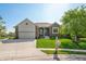 Inviting home featuring a brick facade, well-kept lawn, and attached two-car garage at 2015 Saint Andrews Ct, Franklin, IN 46131