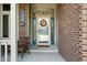 Welcoming front porch with seating, decor, and clear view through the glass door at 2015 Saint Andrews Ct, Franklin, IN 46131