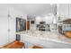 Contemporary kitchen with white cabinets, granite countertops, stainless steel appliances, and breakfast bar at 2015 Saint Andrews Ct, Franklin, IN 46131