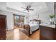Spacious main bedroom with hardwood floors, stylish decor, and outdoor access at 2015 Saint Andrews Ct, Franklin, IN 46131