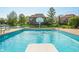 The sparkling swimming pool has a diving board, and basketball hoop, with a picturesque view of the pond at 2015 Saint Andrews Ct, Franklin, IN 46131