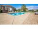 The backyard pool has a basketball hoop, diving board, and ample lounge seating, perfect for summer fun at 2015 Saint Andrews Ct, Franklin, IN 46131