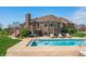 Stunning backyard showcasing a pool with a basketball hoop and lush greenery at 2015 Saint Andrews Ct, Franklin, IN 46131