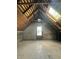 Bright attic featuring exposed beams, skylight, and unfinished walls at 2119 S Garfield Dr, Indianapolis, IN 46203