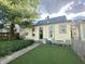 A charming backyard featuring a small green space with an artificial turf lawn at 2119 S Garfield Dr, Indianapolis, IN 46203