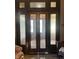 Classic entryway featuring glass panel doors, offering a view of the home's elegant interior at 2119 S Garfield Dr, Indianapolis, IN 46203