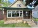 Charming bungalow featuring a brick foundation, and inviting front entrance at 2119 S Garfield Dr, Indianapolis, IN 46203
