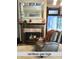 Inviting living room features a beautiful fireplace with ventless gas logs and a decorative mirror above the mantel at 2119 S Garfield Dr, Indianapolis, IN 46203