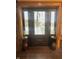 Front entry featuring a wood door with sidelights, decorative side tables, and a welcoming ambiance at 2119 S Garfield Dr, Indianapolis, IN 46203