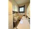 Laundry room featuring updated washer and dryer, with upper cabinets and sink for laundry convenience at 2119 S Garfield Dr, Indianapolis, IN 46203
