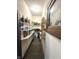 Pantry area with ample shelving, ideal for storing kitchen staples, with a window on one side at 2119 S Garfield Dr, Indianapolis, IN 46203