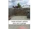Large enclosed parking area next to garage is fenced and has gravel for easy maintenance at 2119 S Garfield Dr, Indianapolis, IN 46203