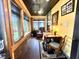 Cozy sun room featuring ample natural light, wood accents, and a comfortable seating area at 2119 S Garfield Dr, Indianapolis, IN 46203
