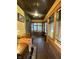 Inviting sun room with multiple windows, wood trim, and stylish decor, creating a warm atmosphere at 2119 S Garfield Dr, Indianapolis, IN 46203