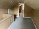 An attic with finished floors and neutral paint at 2271 Park Ave, Columbus, IN 47201