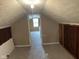 Spacious attic featuring carpet and a view into another room, great for flexible living at 2271 Park Ave, Columbus, IN 47201