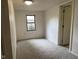 Cozy bedroom with new carpeting, painted walls and a window at 2271 Park Ave, Columbus, IN 47201