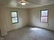 Comfortable bedroom featuring neutral carpeting, neutral walls and a large window at 2271 Park Ave, Columbus, IN 47201