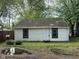 Charming single-story home with white siding, green trim, and a well-maintained front yard at 2271 Park Ave, Columbus, IN 47201