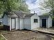 Back exterior view of home with a deck, showing yard and detached garage at 2271 Park Ave, Columbus, IN 47201