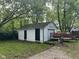 View of the detached garage with a dual door entrance and backyard space at 2271 Park Ave, Columbus, IN 47201