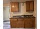 A modest kitchen with wood cabinets and a stainless steel sink at 2271 Park Ave, Columbus, IN 47201