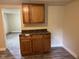 A modest kitchen with wood cabinets and laminate floors at 2271 Park Ave, Columbus, IN 47201