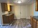 Well-lit kitchen featuring new floors, cabinets, and a sink at 2271 Park Ave, Columbus, IN 47201