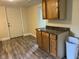 A modest kitchen with wood cabinets and laminate floors at 2271 Park Ave, Columbus, IN 47201
