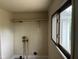 A laundry room with a window and plumbing hookups at 2271 Park Ave, Columbus, IN 47201