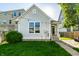 Beautiful backyard featuring a lush lawn, privacy fence, and string lights for evening enjoyment at 2306 Alabama St, Indianapolis, IN 46205