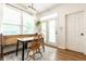Dining area featuring wooden table, chairs, and built-in bench seating at 2306 Alabama St, Indianapolis, IN 46205