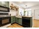 Beautiful kitchen with green cabinets, butcher block countertops, and modern appliances at 2306 Alabama St, Indianapolis, IN 46205