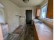 The kitchen features laminate counters, a stainless steel sink, and space for appliances at 2315 E 3Rd St, Anderson, IN 46012