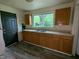 The kitchen has cabinets, laminate counters, a stainless steel sink, and space for appliances at 2315 E 3Rd St, Anderson, IN 46012
