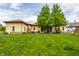Expansive backyard featuring a lush lawn, mature trees, and an inviting outdoor seating area for relaxation and recreation at 2377 Finchley Rd, Carmel, IN 46032
