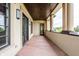 Covered balcony with stone columns, wood ceiling and expansive outdoor views at 2377 Finchley Rd, Carmel, IN 46032